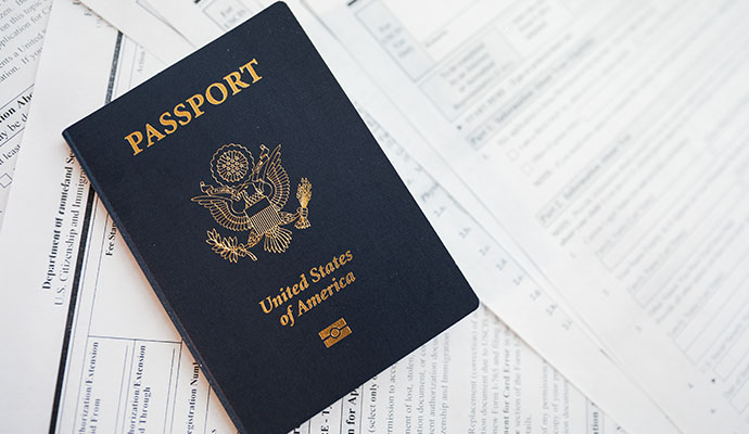 A passport is placed on the official documents