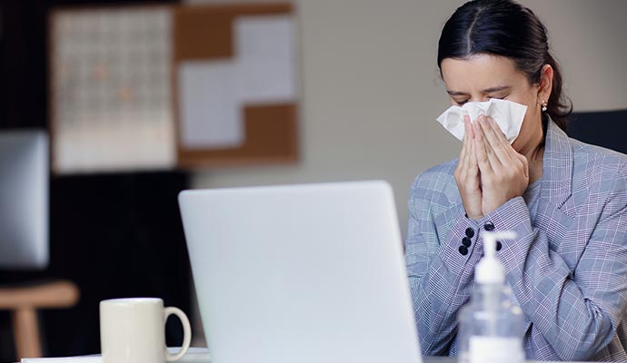 A person is sneezing due to mold exposure