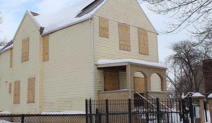 Boarded up house