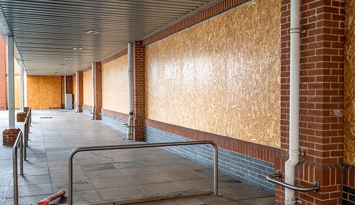 Boarded-up wall on a commercial building