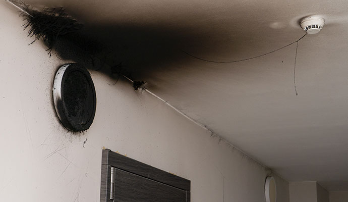 Smoke and soot damage on ceiling and wall
