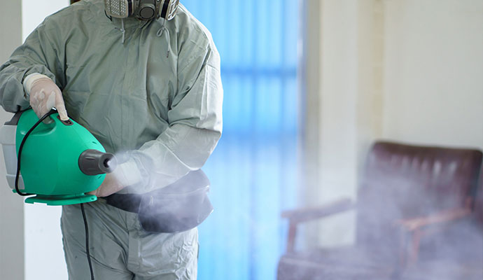 Technician fogging for smoke odor removal