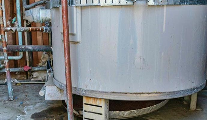 Hot water heater leak restoration service