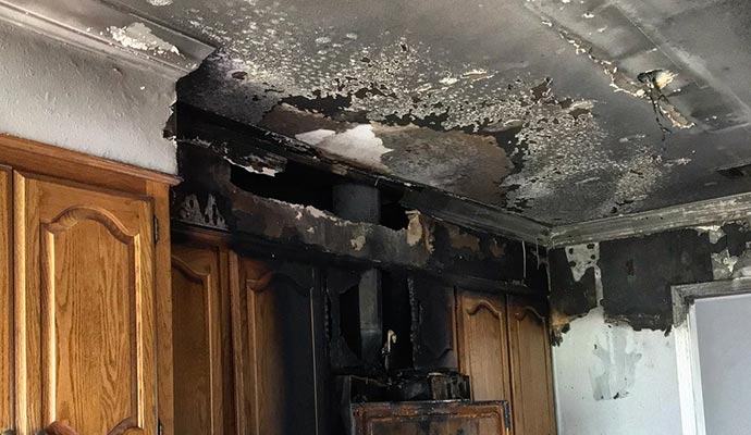 Severely soot damaged kitchen
