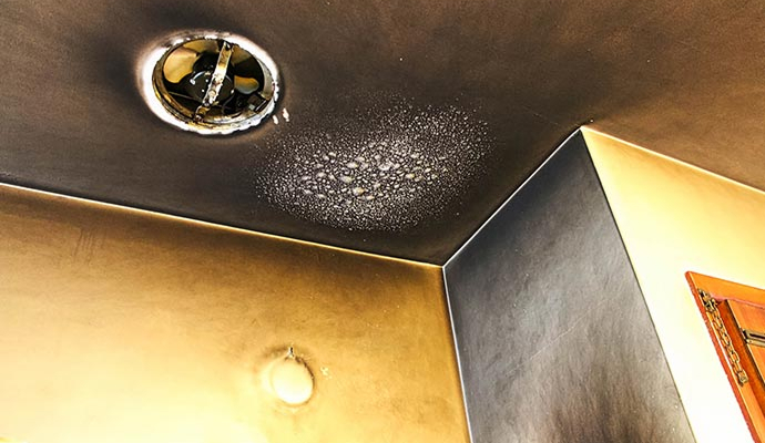 Smoke damaged wall and ceiling