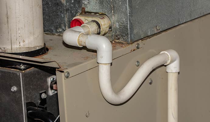 Closeup view of a HVAC condensate drain line