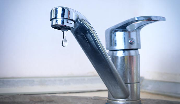 Water dripping from a leaky faucet