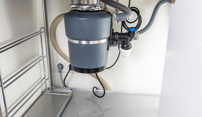 Water leaking from a garbage disposal