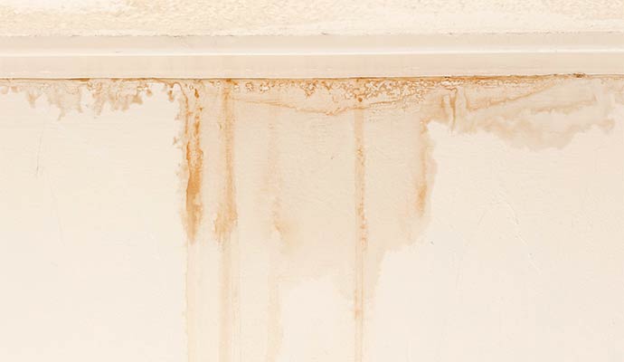 Water leak stains on ceiling drywall