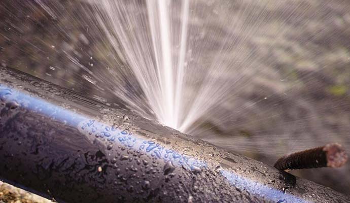Water leaking from burst pipe