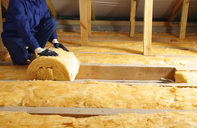 Worker doing insulation replacement